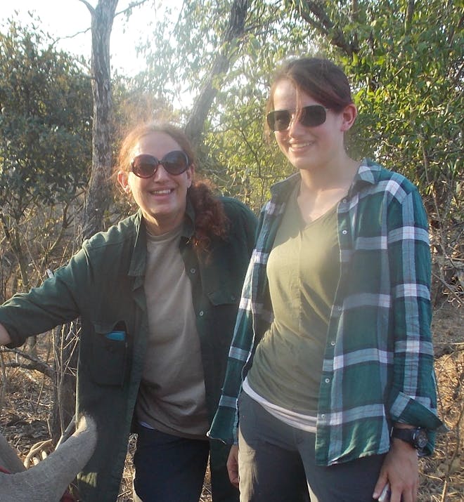 Linda and Catherine Kensett with a sedated rhino