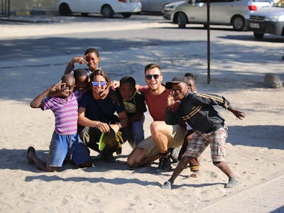 Miguel de Cruylles: volunteers posing with local community children