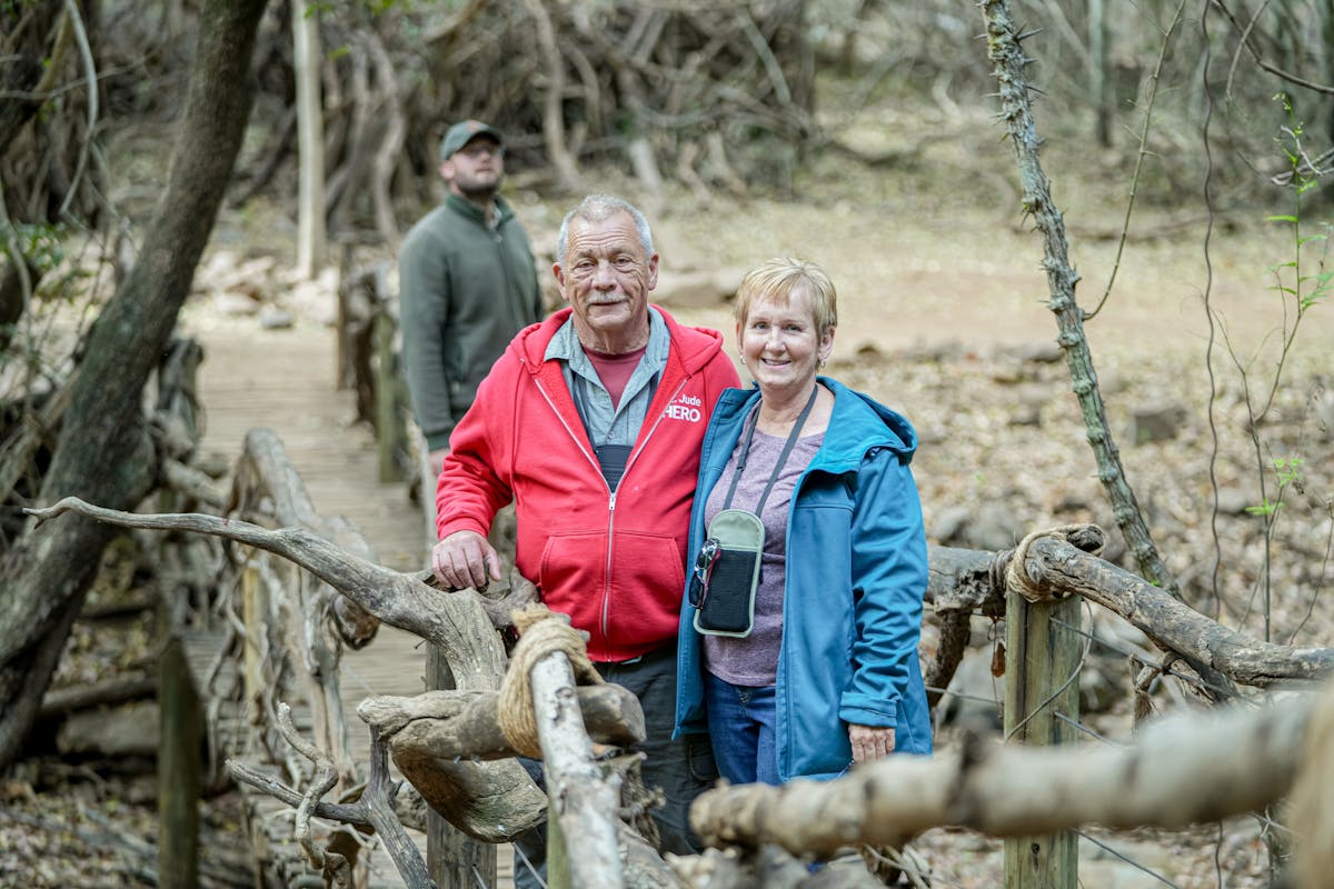 Patrick Brandon: a male and female volunteer posing in the bush