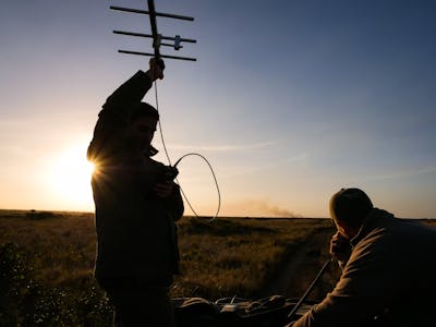 ACE volunteers using telemetry as the sun sets, photo taken by volunteer Kaden