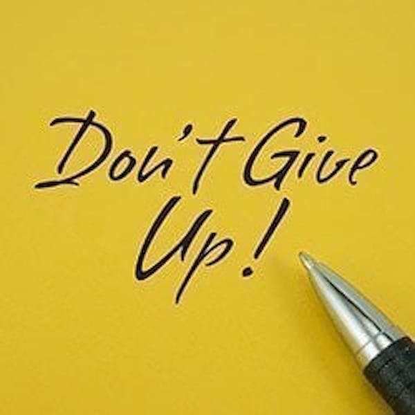 The words 'Don’t Give Up!'