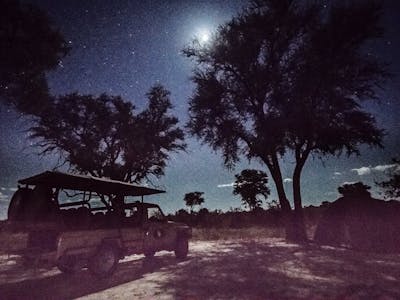 Night-time shot of the mobile camp and vehicle in the Okavango