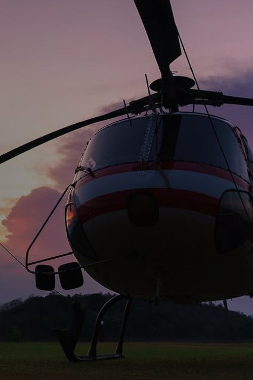 A stationary helicopter at dusk