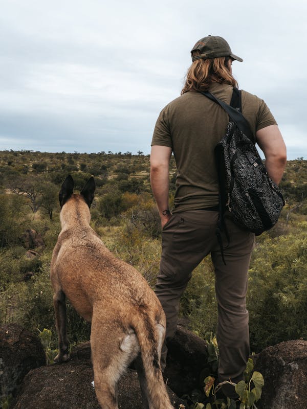 ACE volunteer posing with an anti-poaching dog