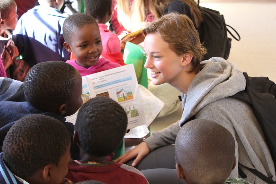 An ACE student teaching primary school age kids in an African School