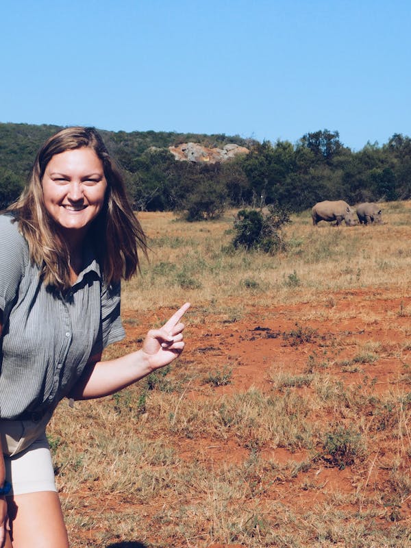 Micaela Chaffin: posing with rhinos in the background