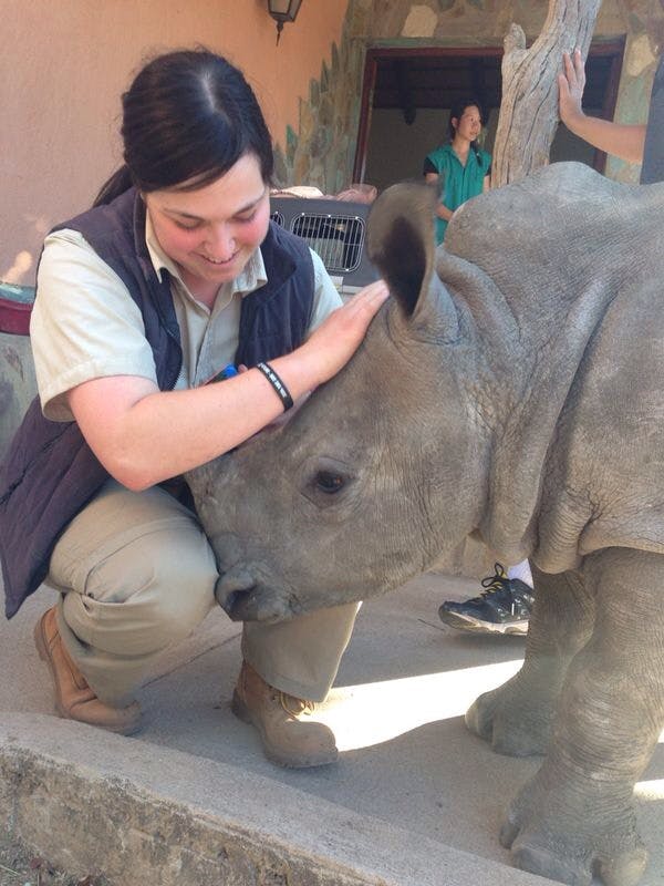 Sophie Gates: posing with a baby rhino