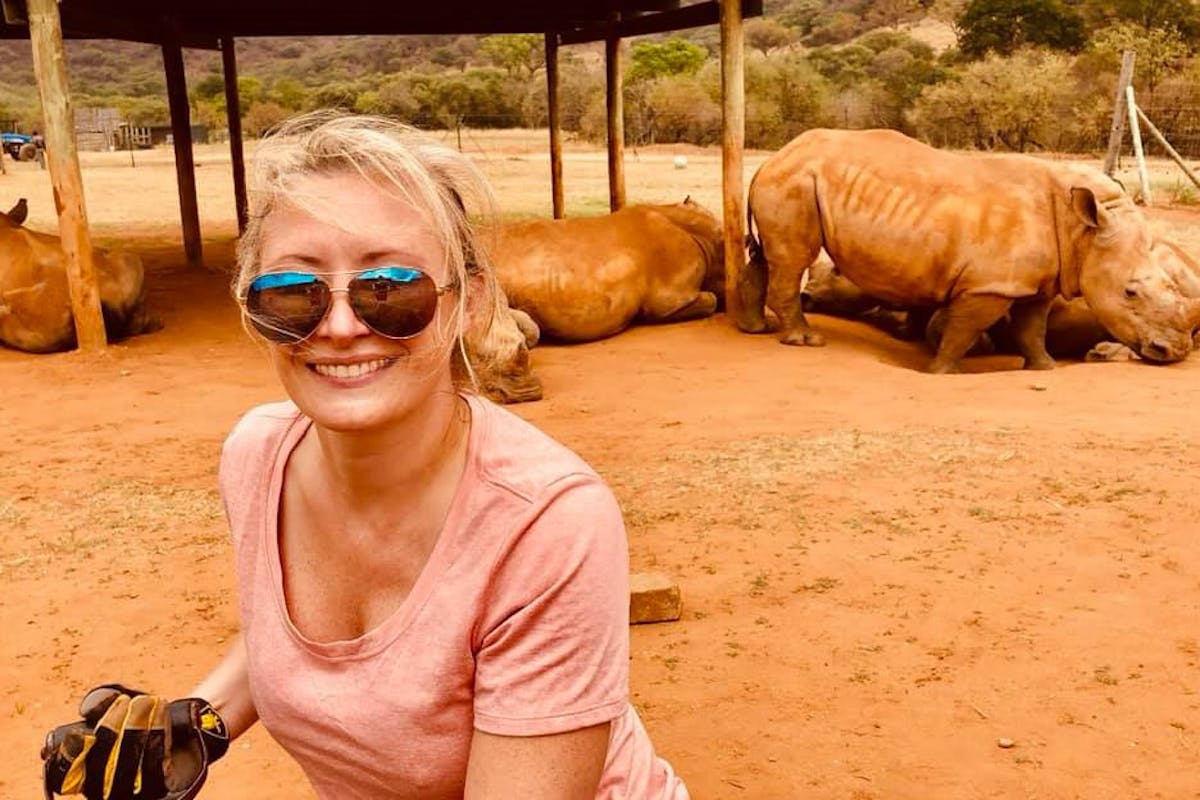 Stephanie Wallace: photo with rhinos in the background