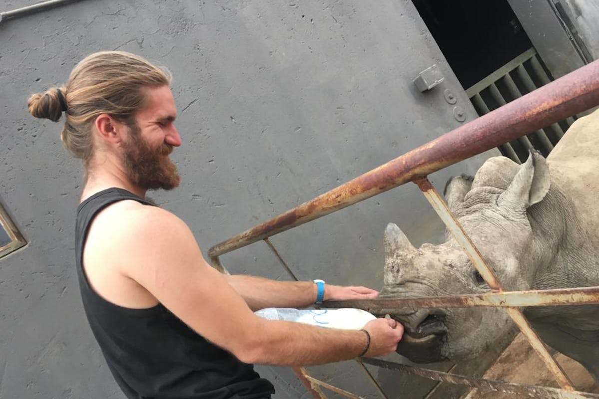 Lucas Zermatten: bottle feeding a rhino
