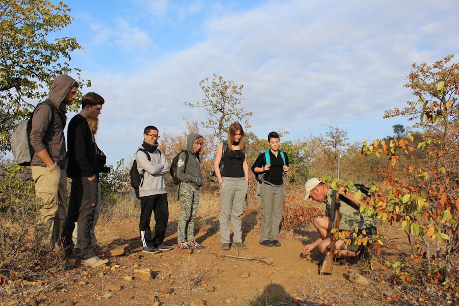 ACE students learn tracking with a ranger 