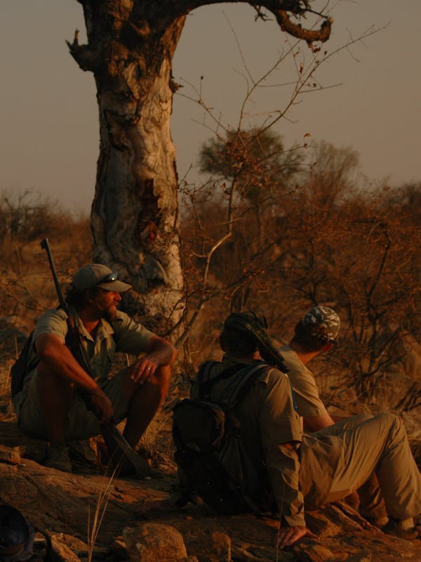 Group of ACE volunteers and game rangers relaxing in the bush
