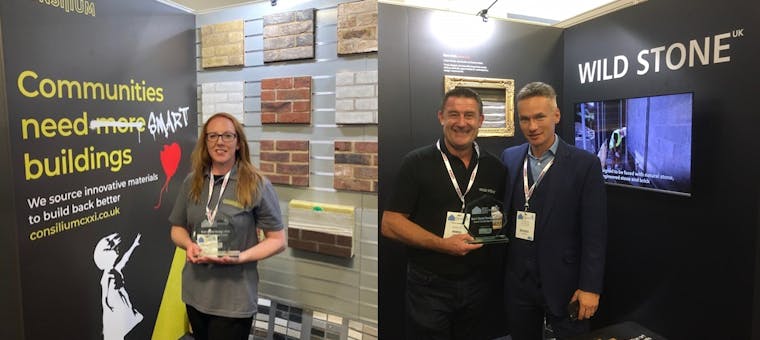 Photos of the Consilium group team with their awards for the best stand at Kent Construction Expo