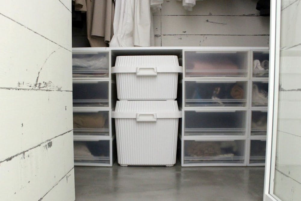 like-it Fluted Storage Bins stacked inside a closet with next to like-it Drawers