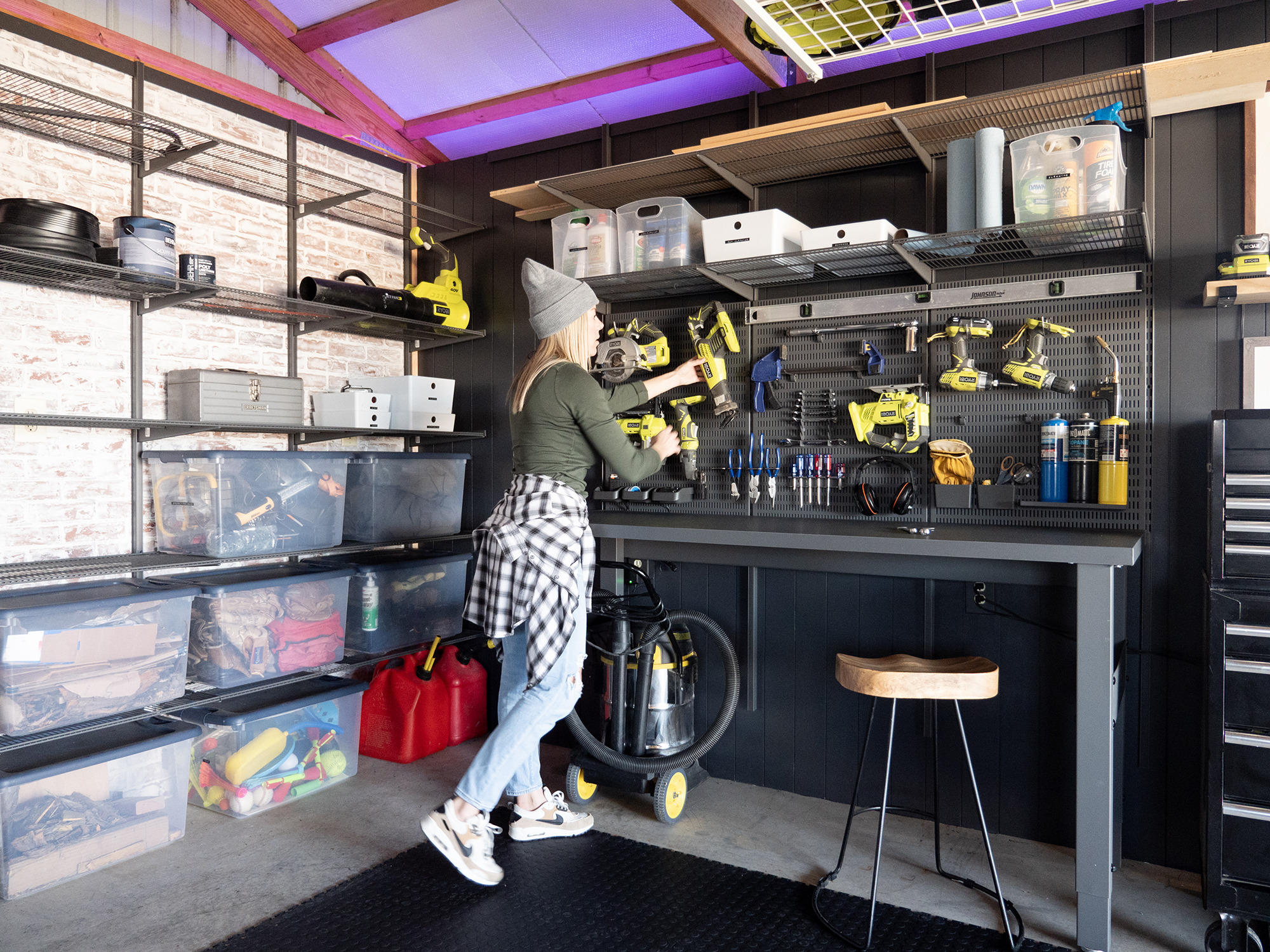 Ashley Smith in the custom Garage+ by Elfa storage space in her barn