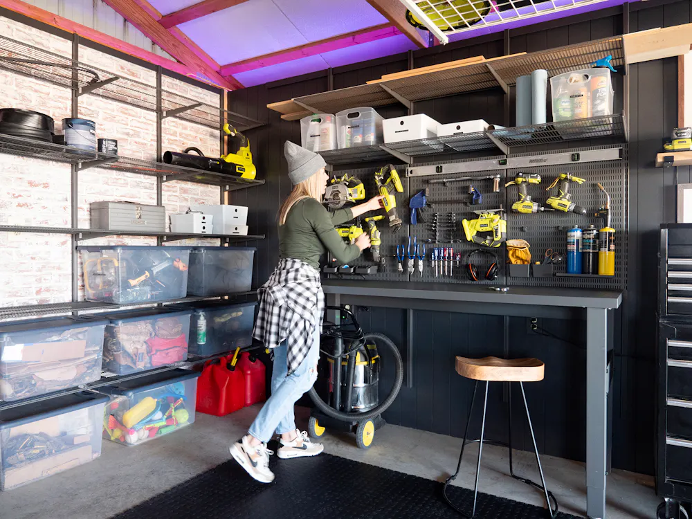 Ashley Smith in the custom Garage+ by Elfa storage space in her barn