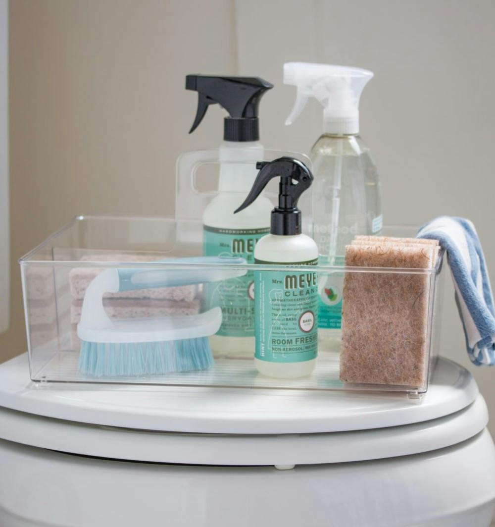 bathroom cleaning supplies in clear caddy organizer - Saw Nail and