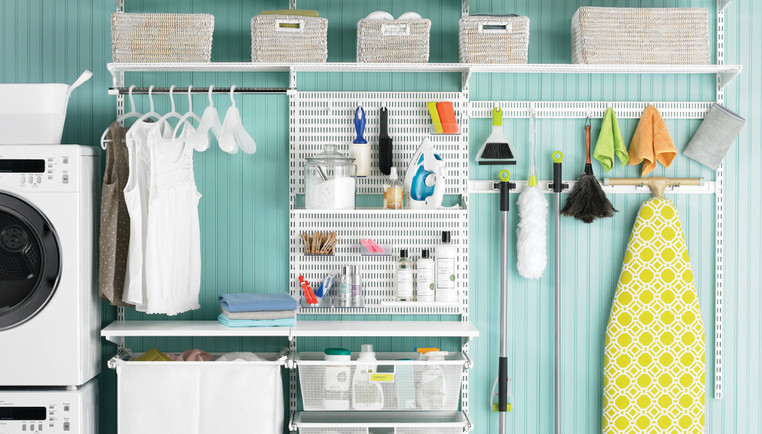 Laundry room of house with appliances storage bins wall shelf rod