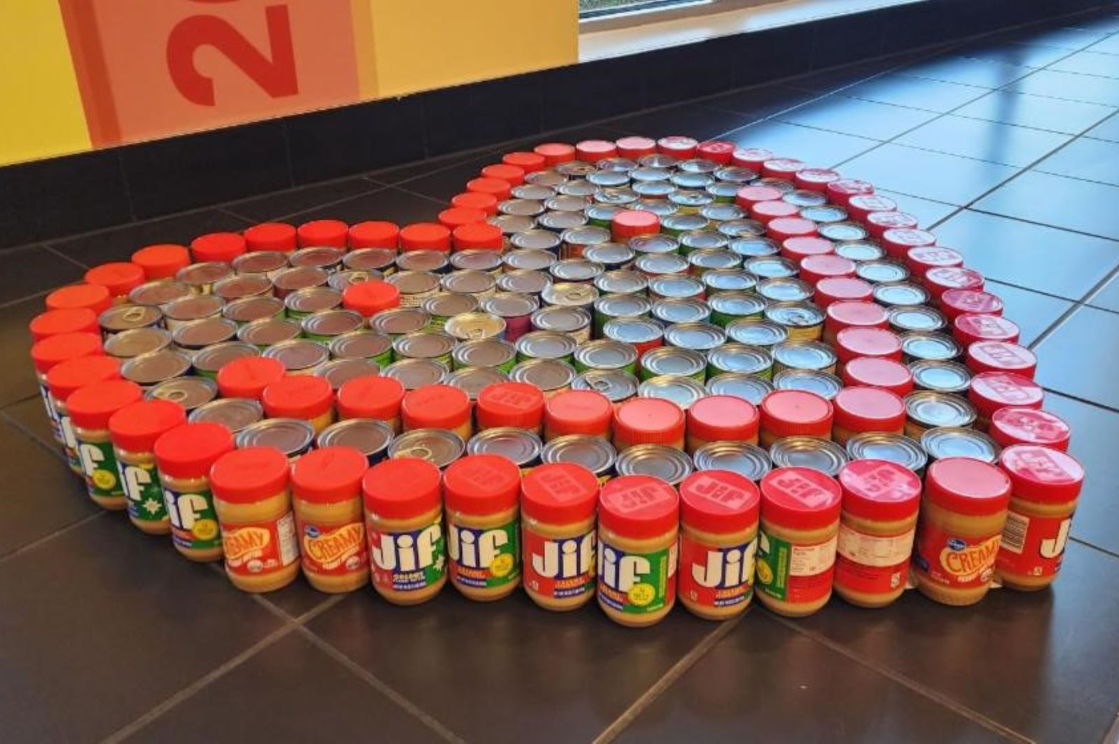 Heart sculpture made out of donated canned goods