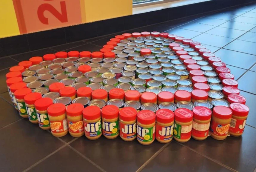 Heart sculpture made out of donated canned goods