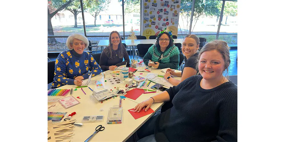 Employees of The Container Store making holiday cards