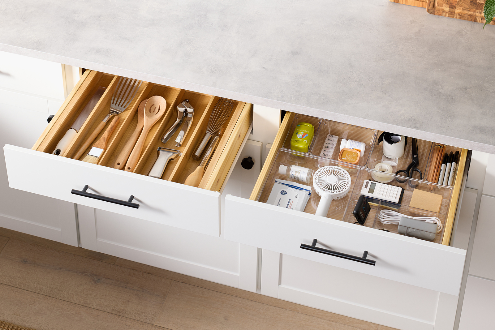 An organized kitchen utensil and junk drawer