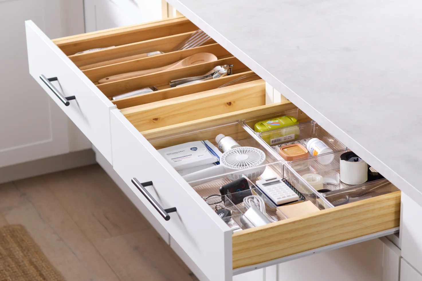 An organized utensil and junk drawer