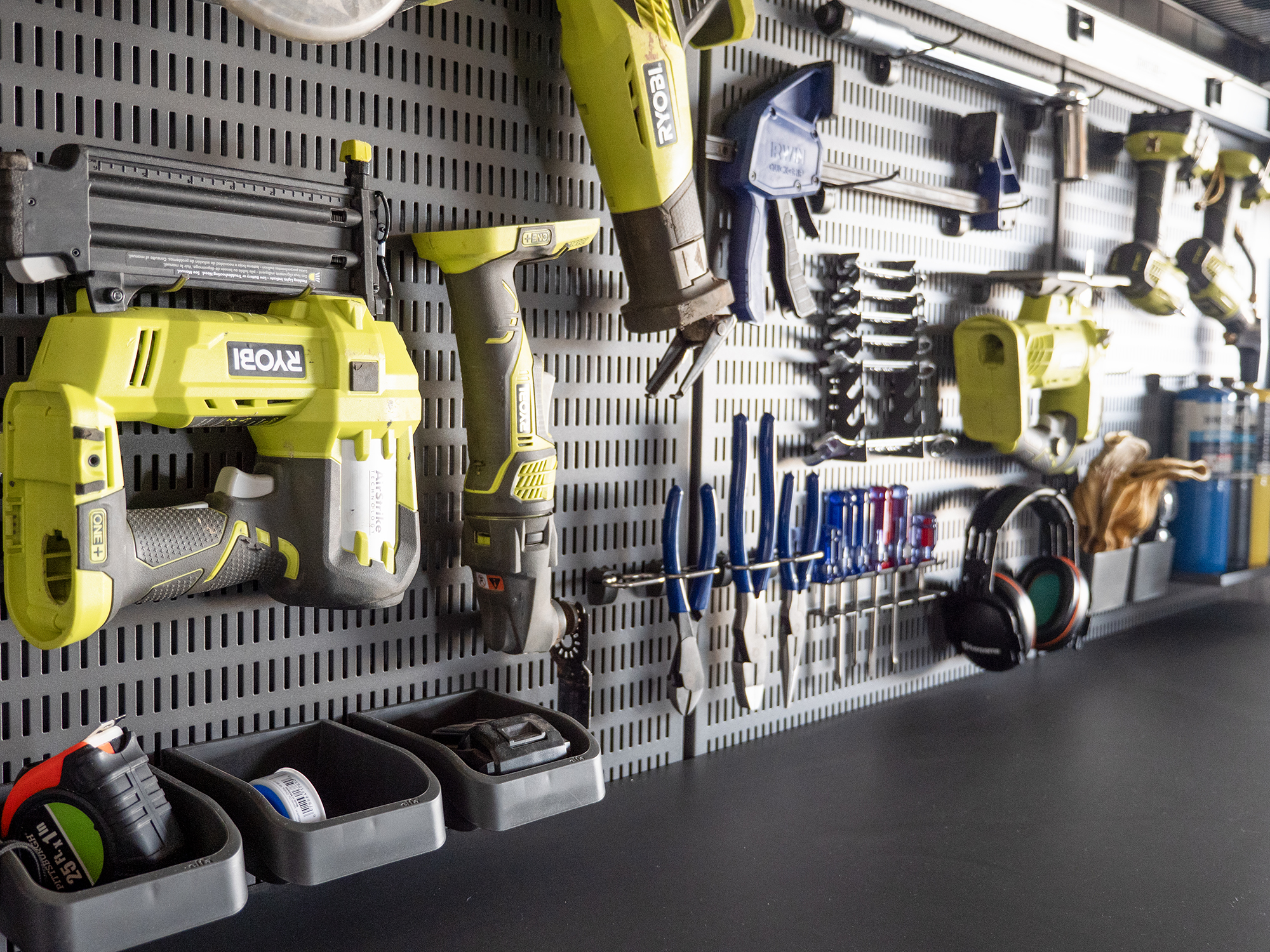 Ashley Smith's Garage+ by Elfa pegboard filled with tools