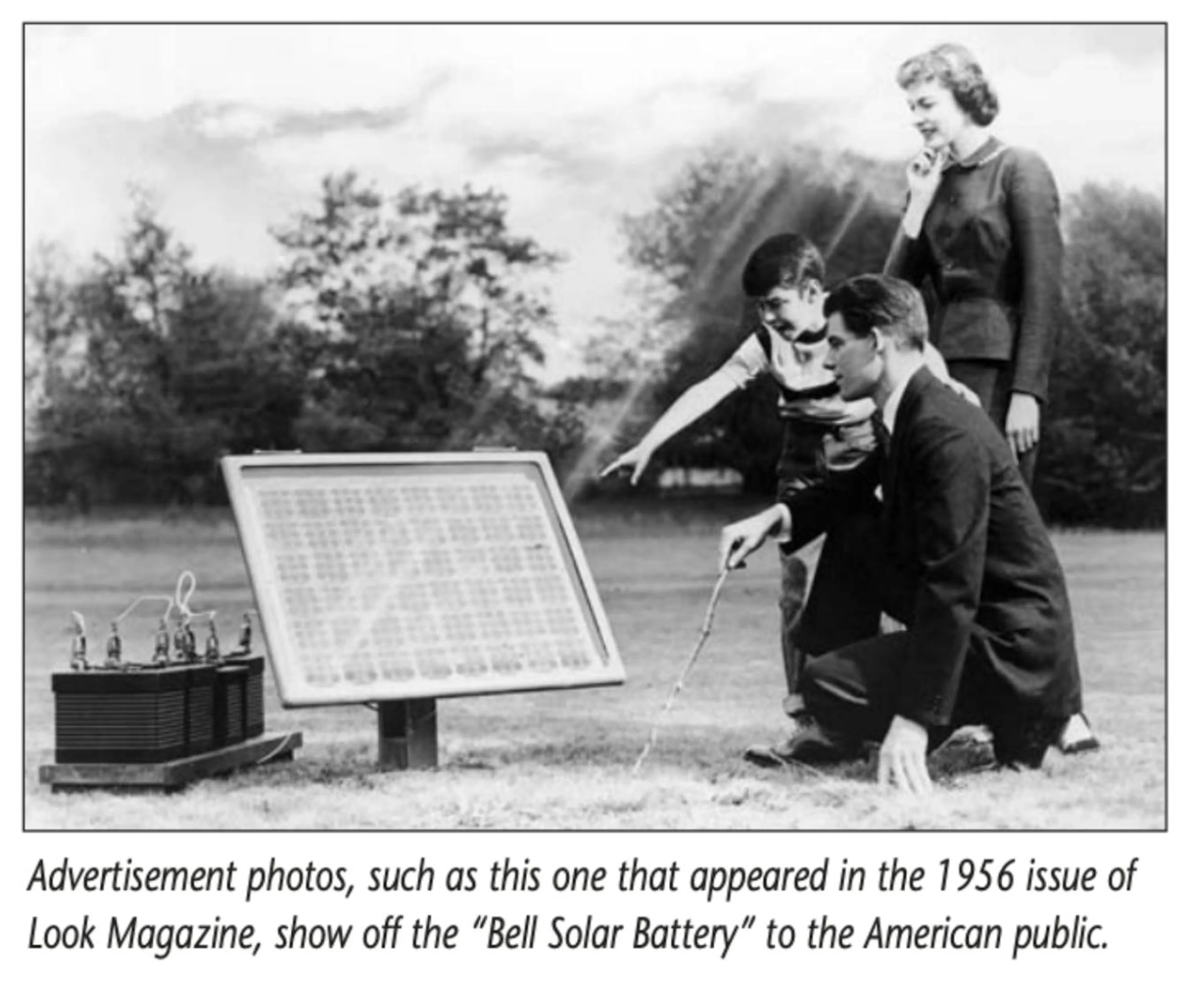 1956 advertisement photograph of the Bell Solar Battery, a panel demonstrated outdoors to onlookers