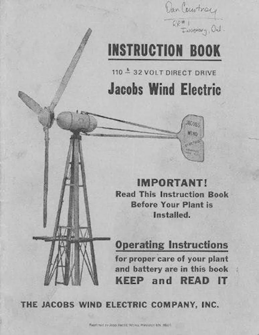 Cover of the Jacobs Wind Electric instruction book, showing a line drawing of a three-blade turbine on a lattice tower