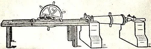 Engraving of an early industrial lathe with hand wheel and mounted workpiece