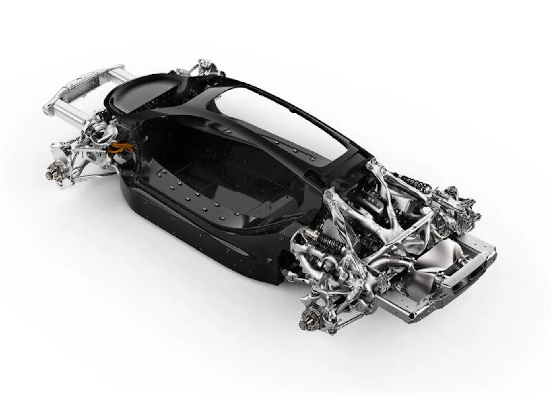 Photograph of a hypercar chassis with 3D-printed suspension and structural components in polished metal