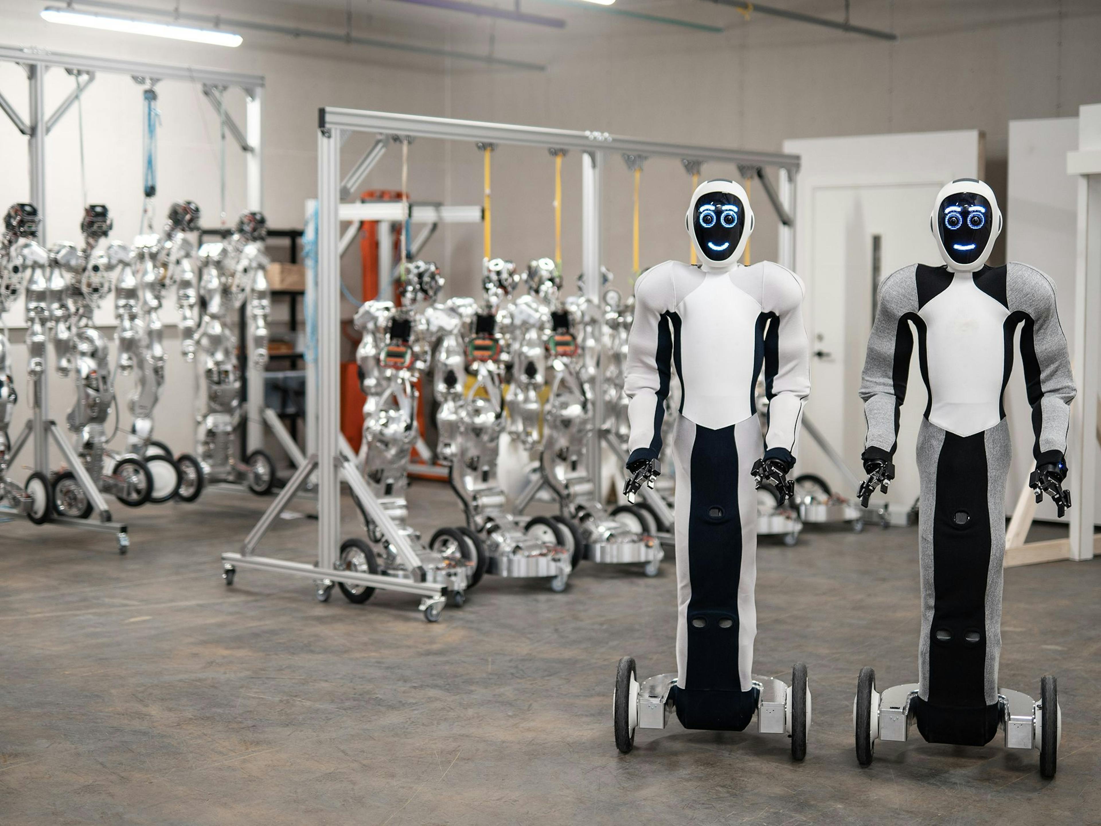 Two Eve robots by 1X