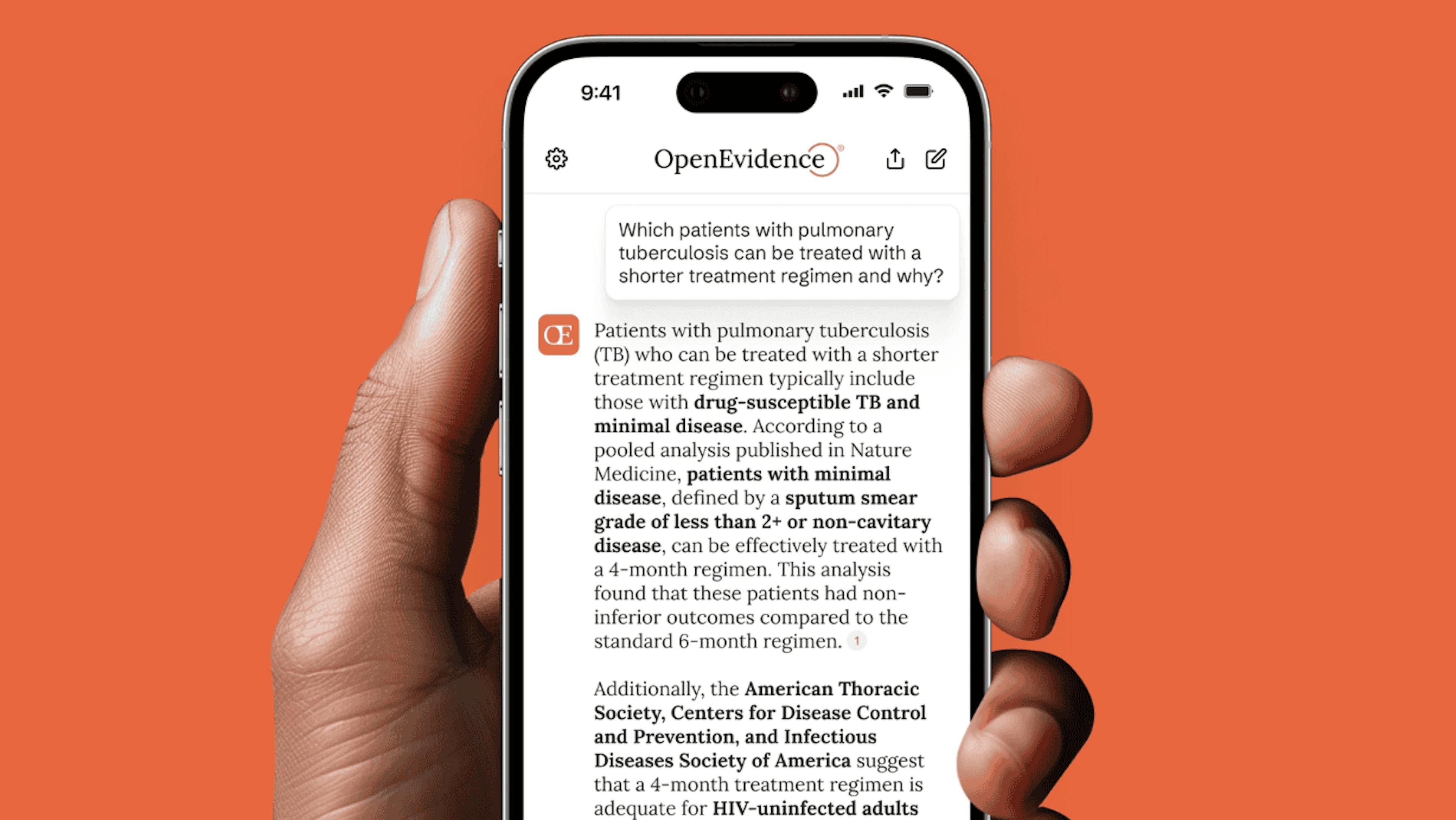 Hand holding a phone displaying an OpenEvidence medical answer on tuberculosis.