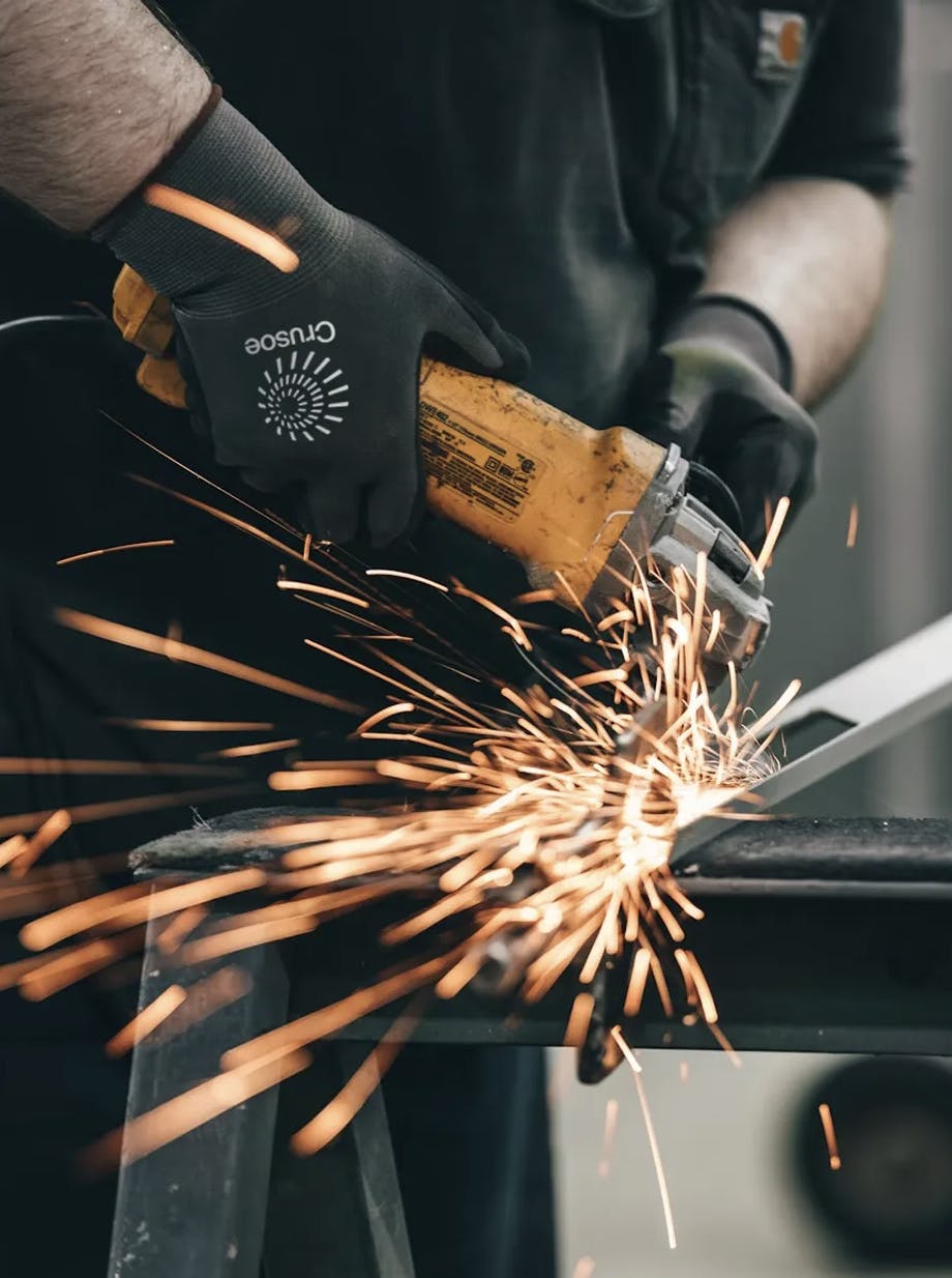 Crusoe technician cutting through material