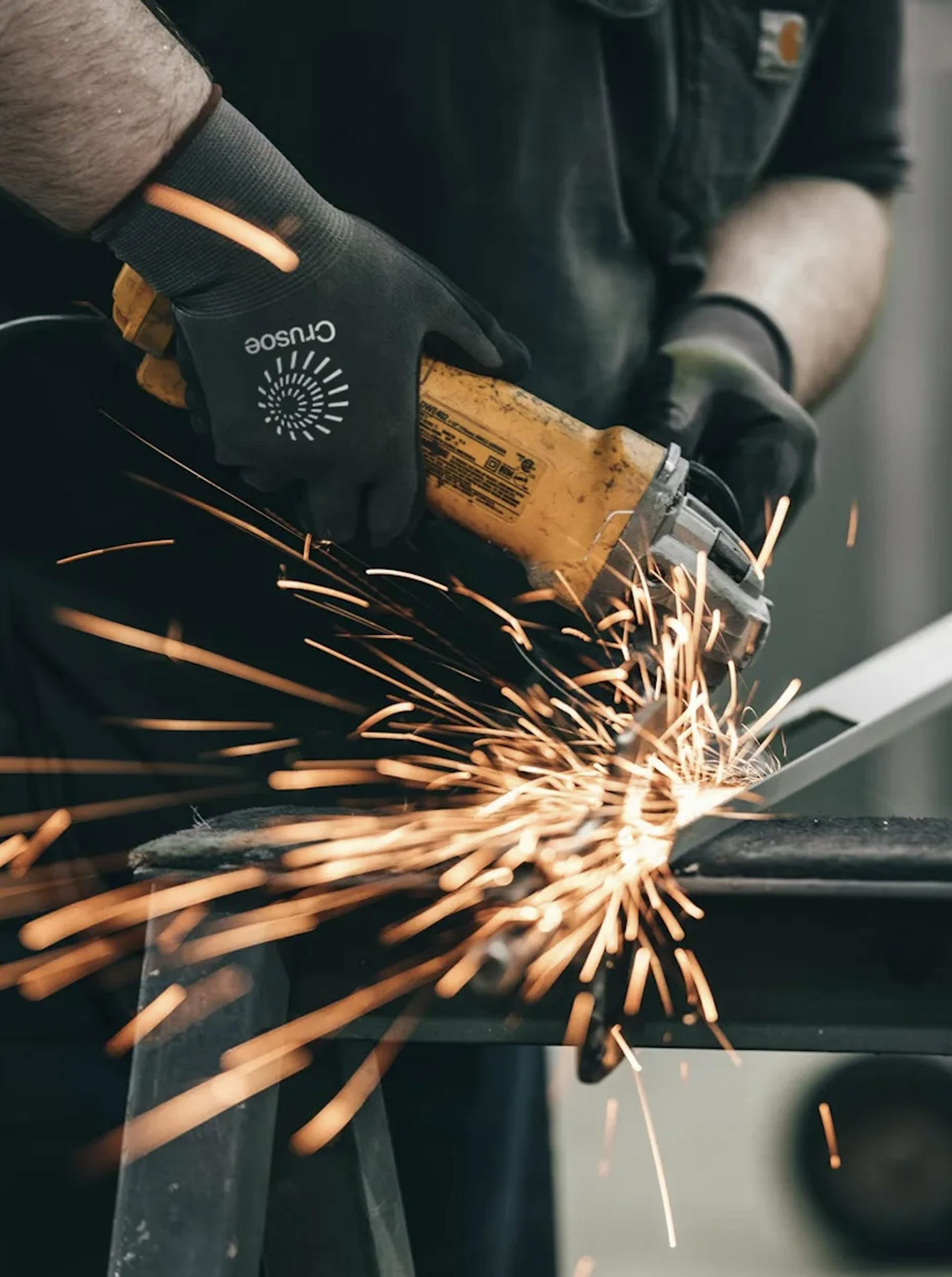 Crusoe technician cutting through material