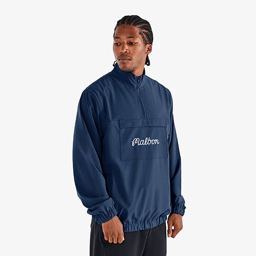 A model wearing the Malbon Cypress Jacket in navy blue