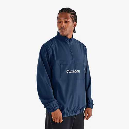 A model wearing the Malbon Cypress Jacket in navy blue