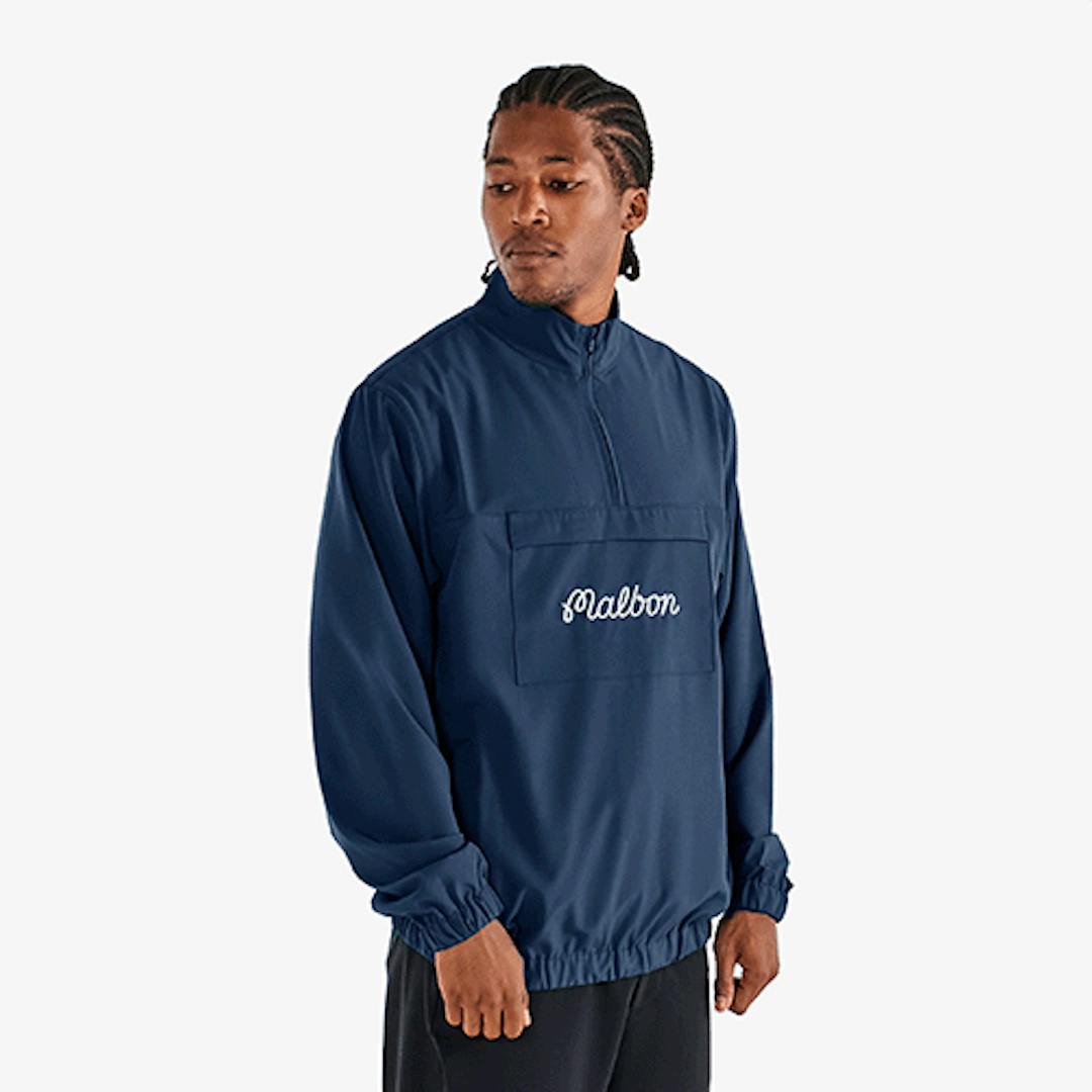 A model wearing the Malbon Cypress Jacket in navy blue