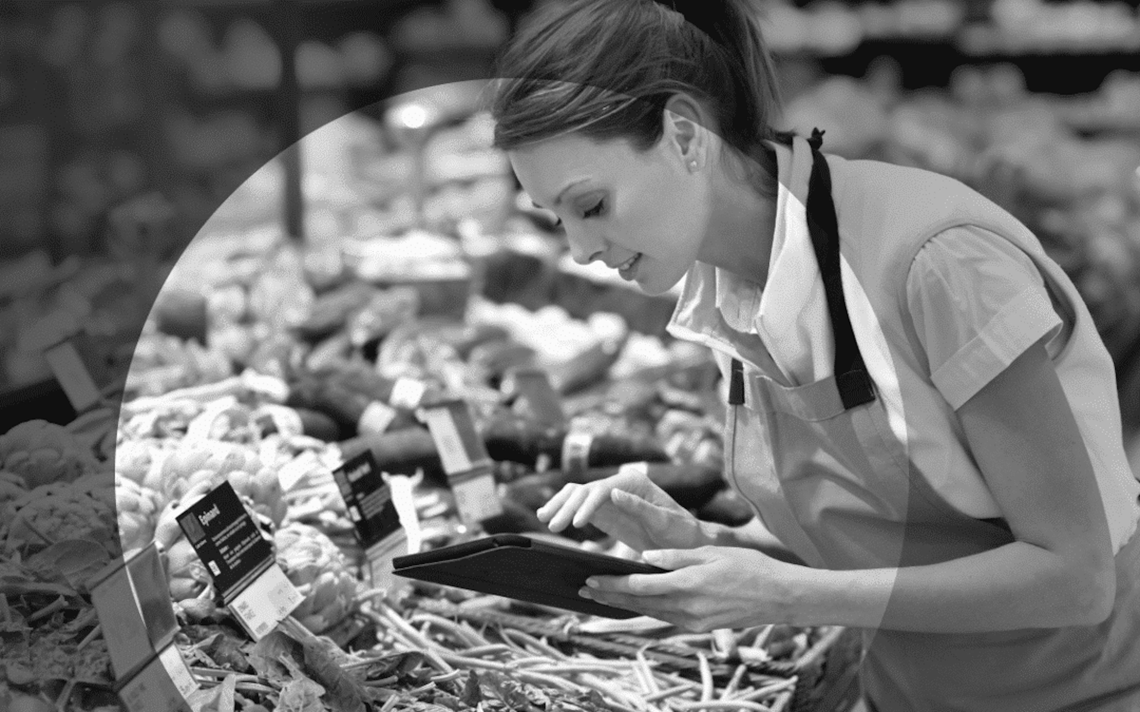 supermarket worker restocking shelves