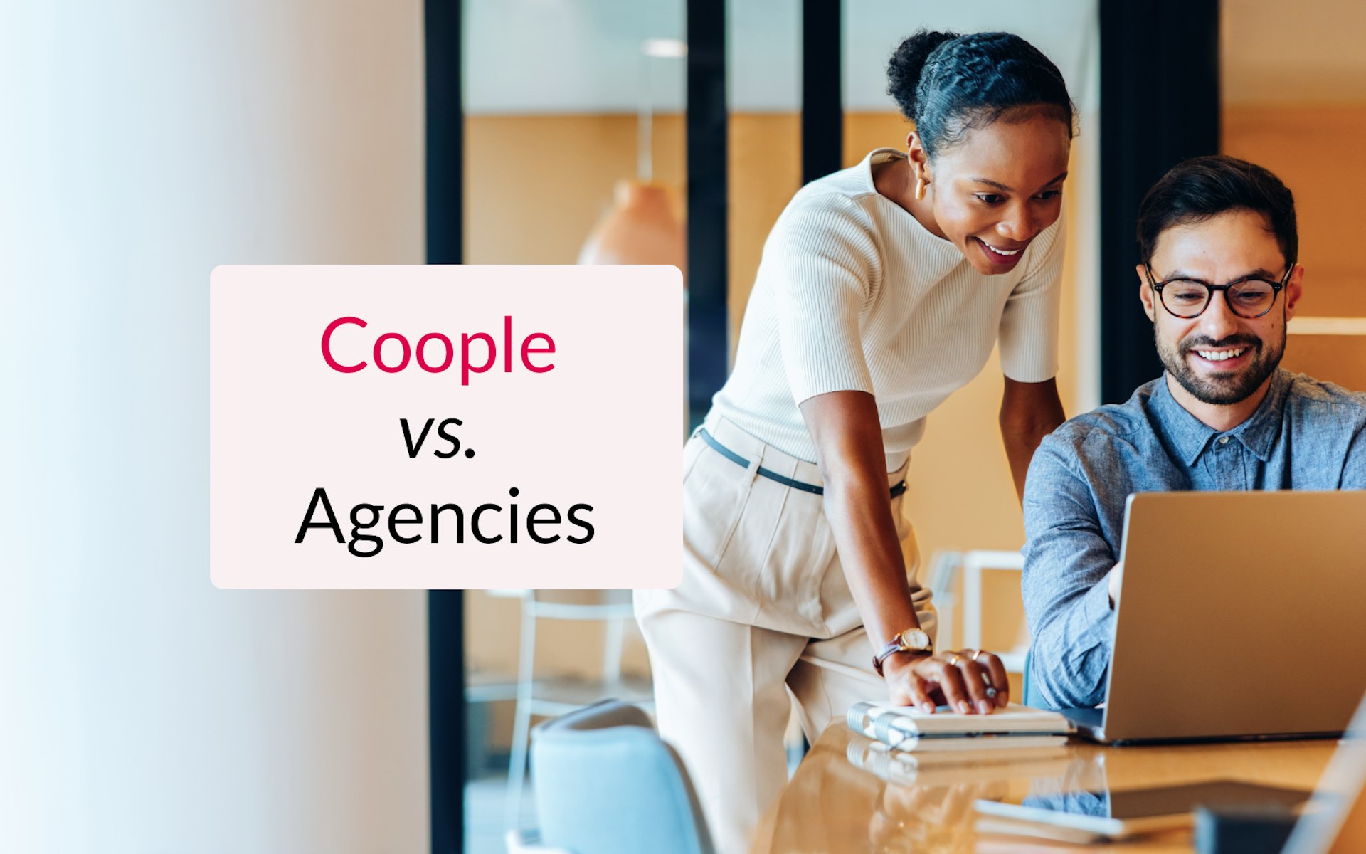 two people looking at a laptop