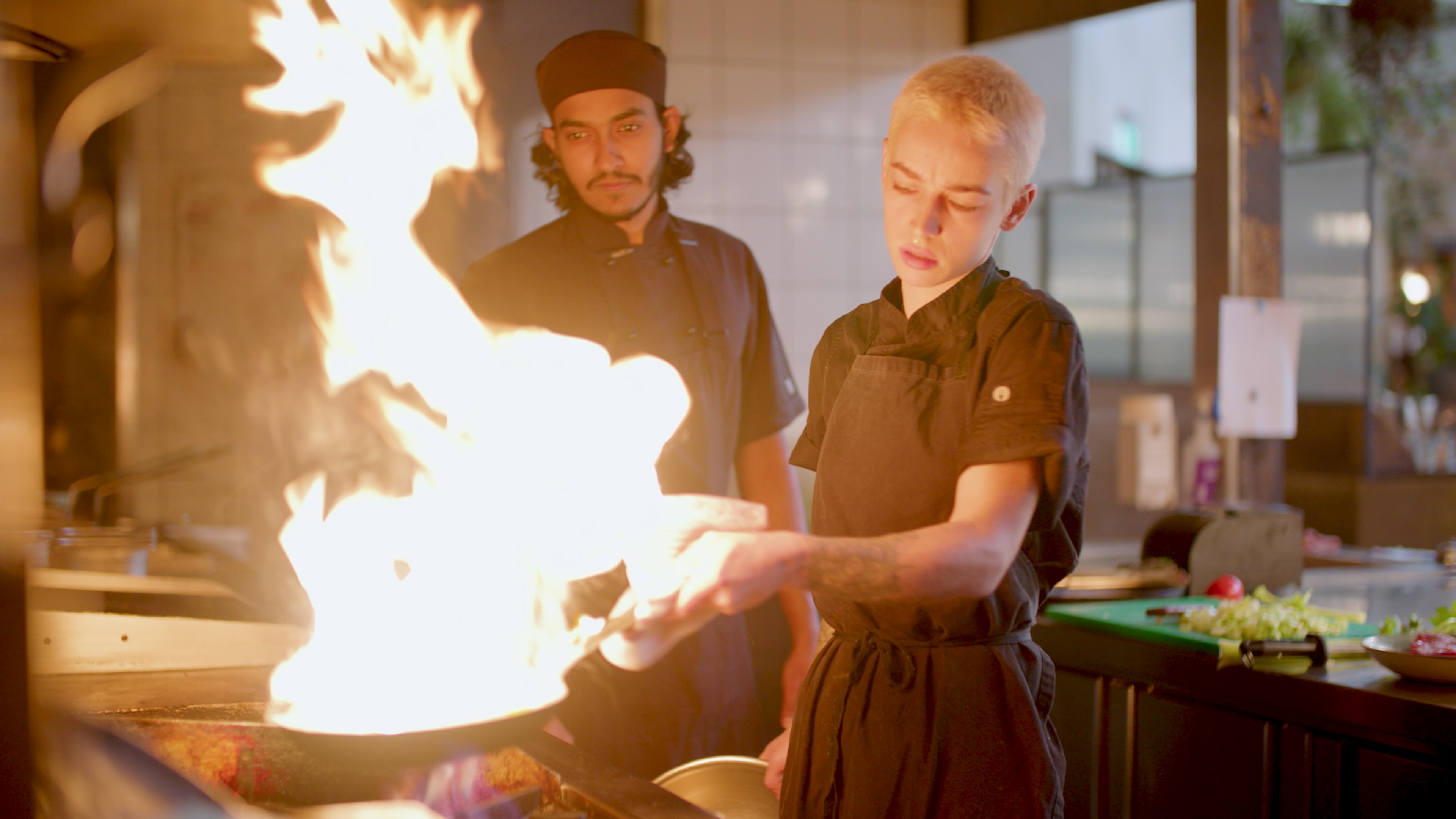 workers cooking in kitchen