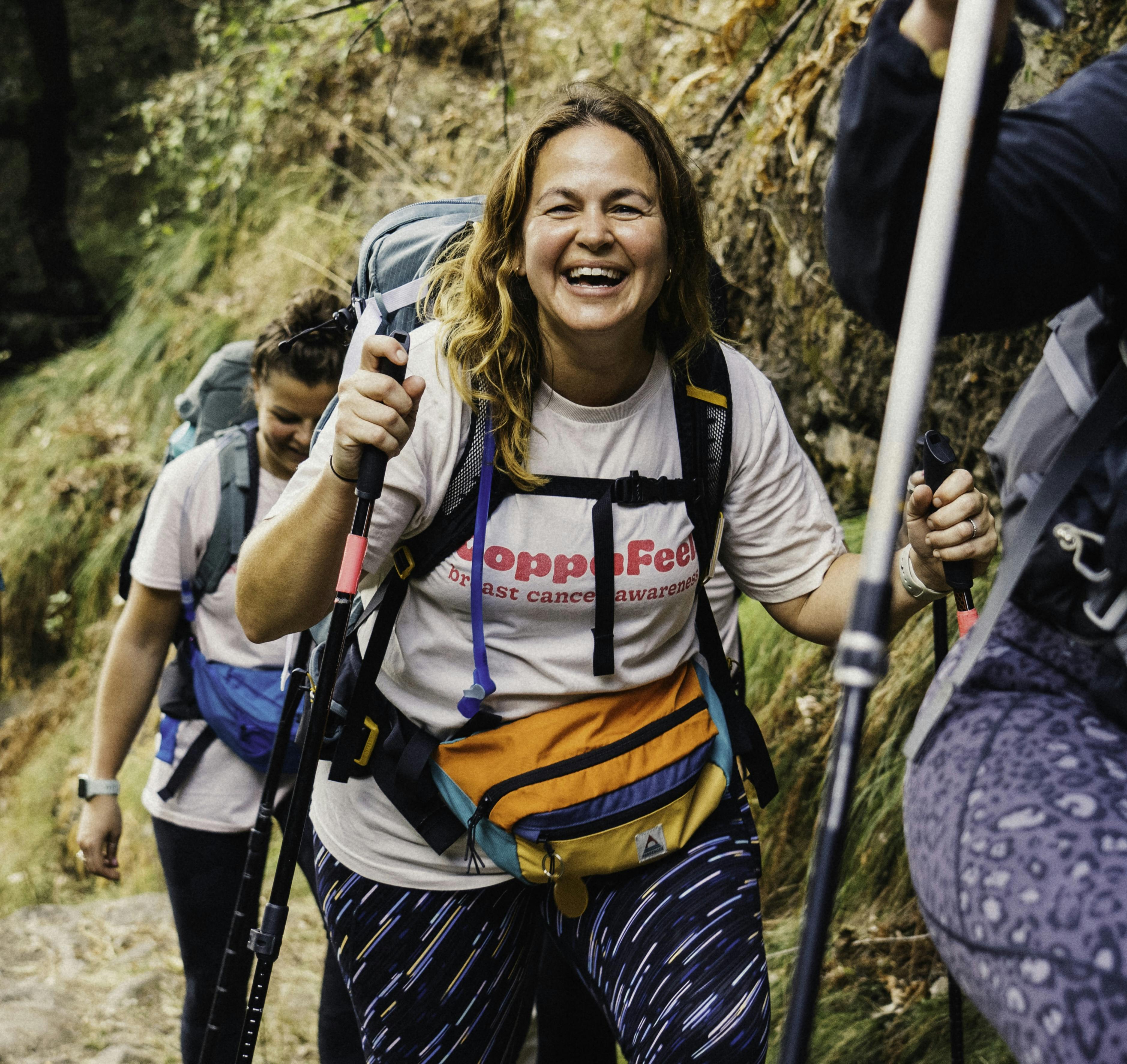 Gi smiling whilst trekking in a CoppaFeel t-shirt