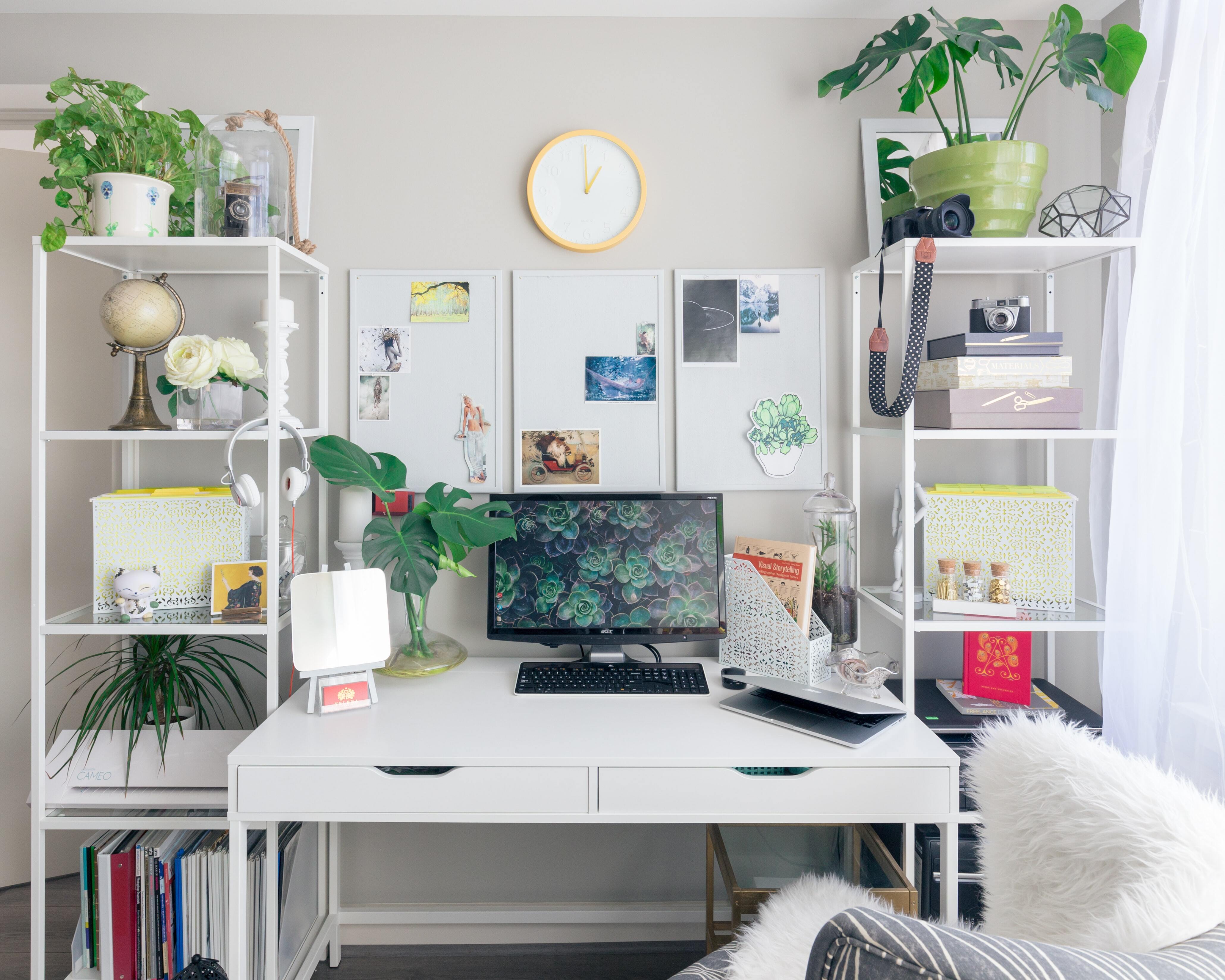 Cover of A bright white desk, decorated with pot plants and other paraphernalia article