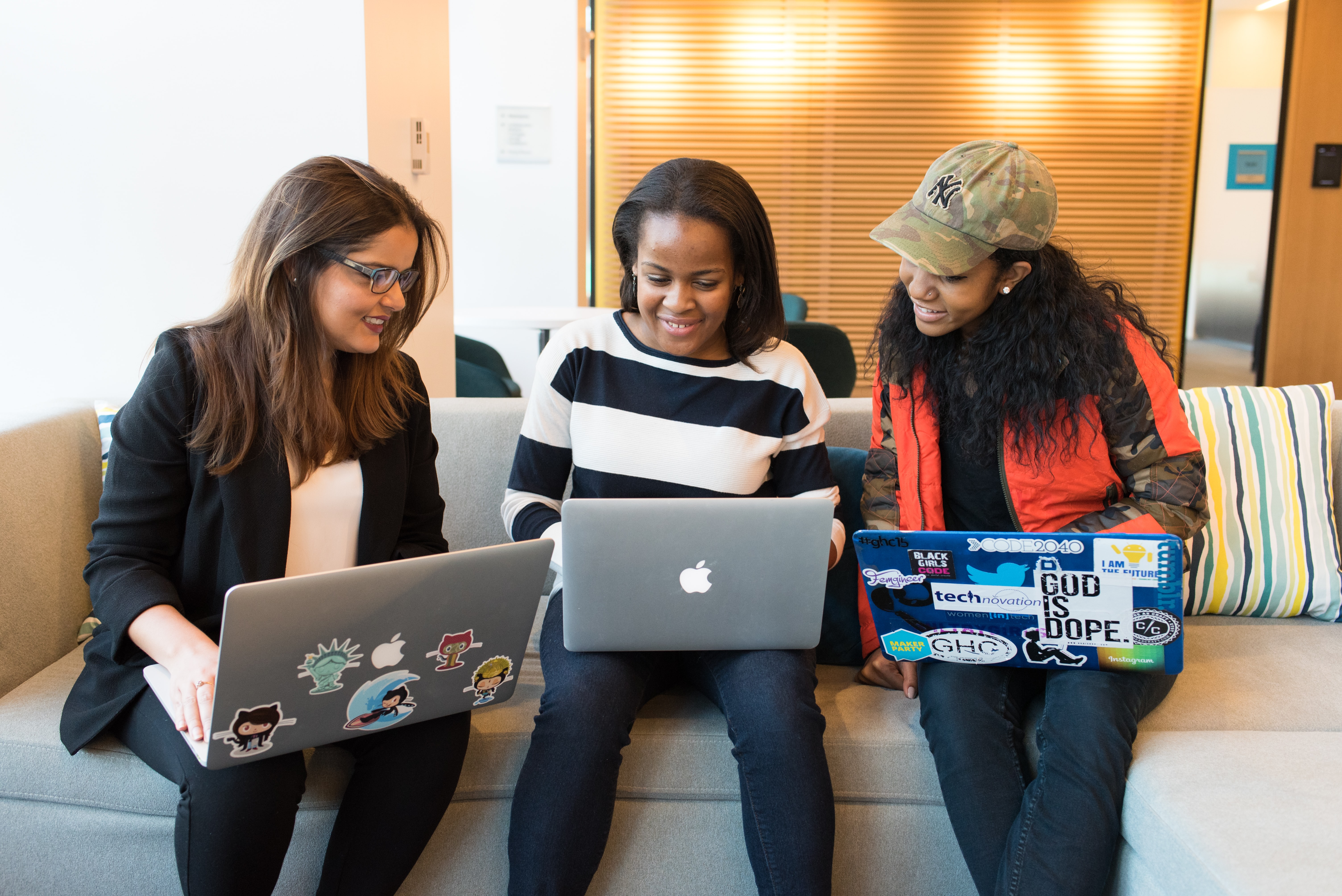 Cover of Three women sitting on a sofa with laptops article