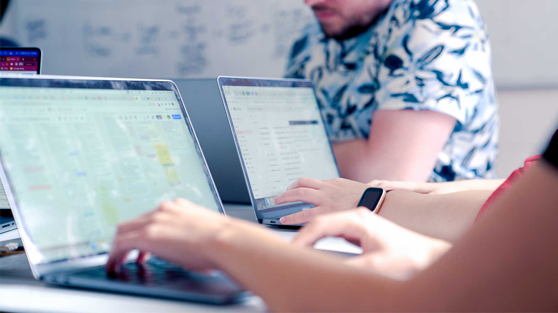 Cover of Two laptops sitting on an office table article