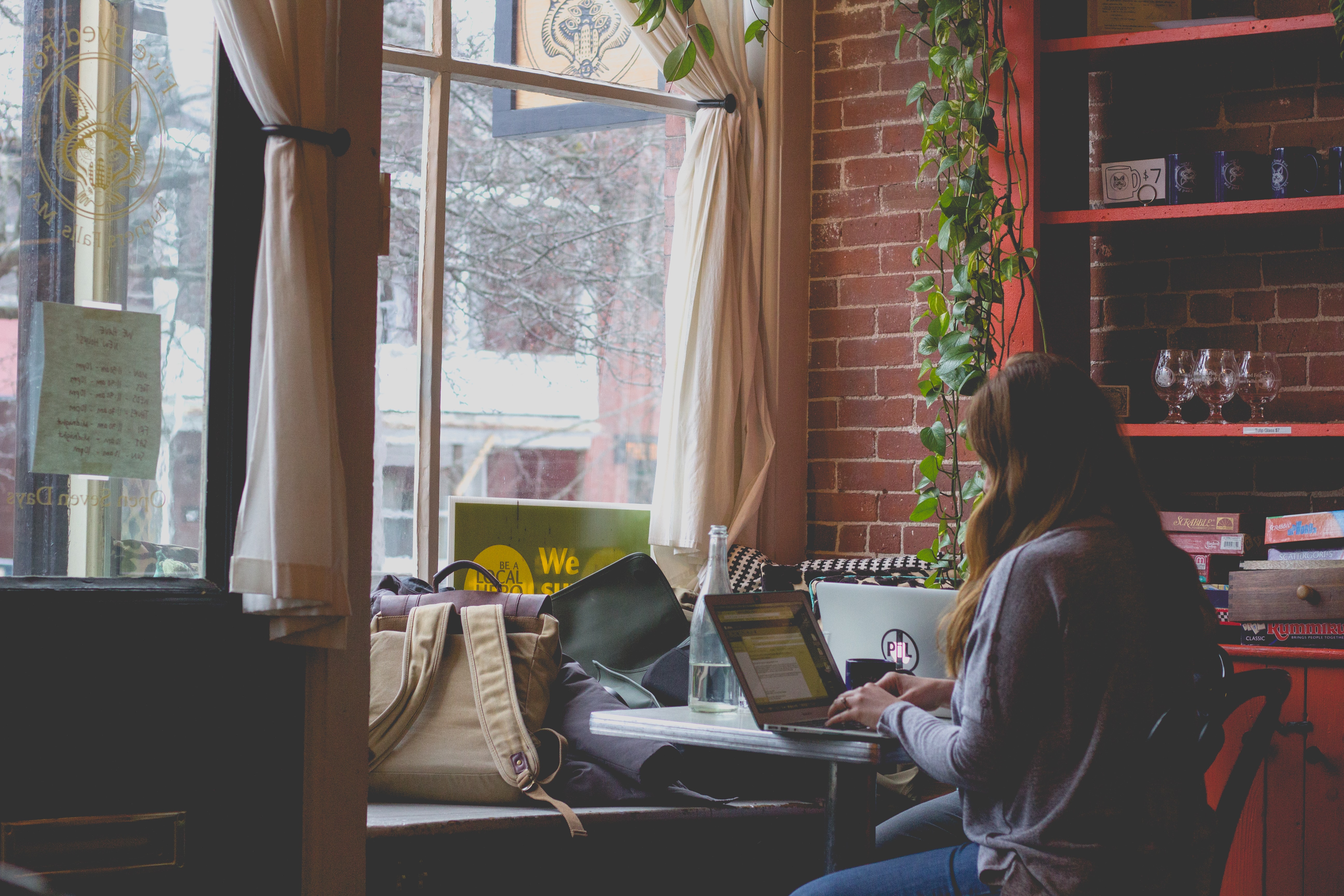 Woman working at a laptop in a home office