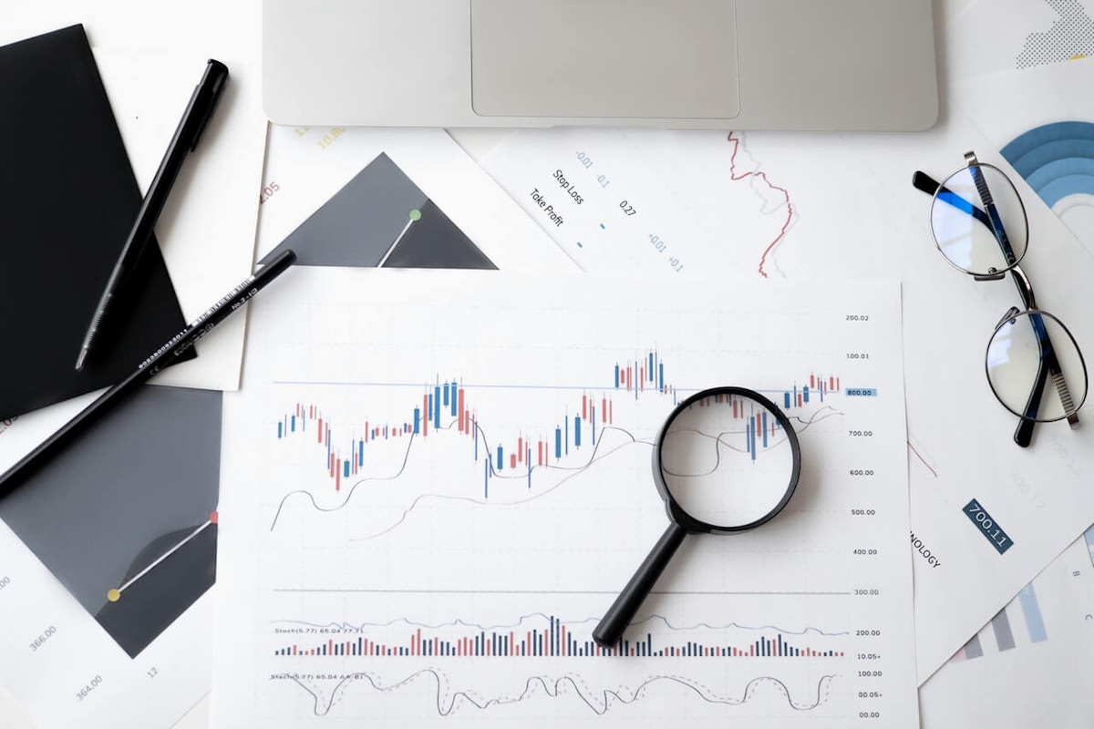 data statistics and a magnifying glass