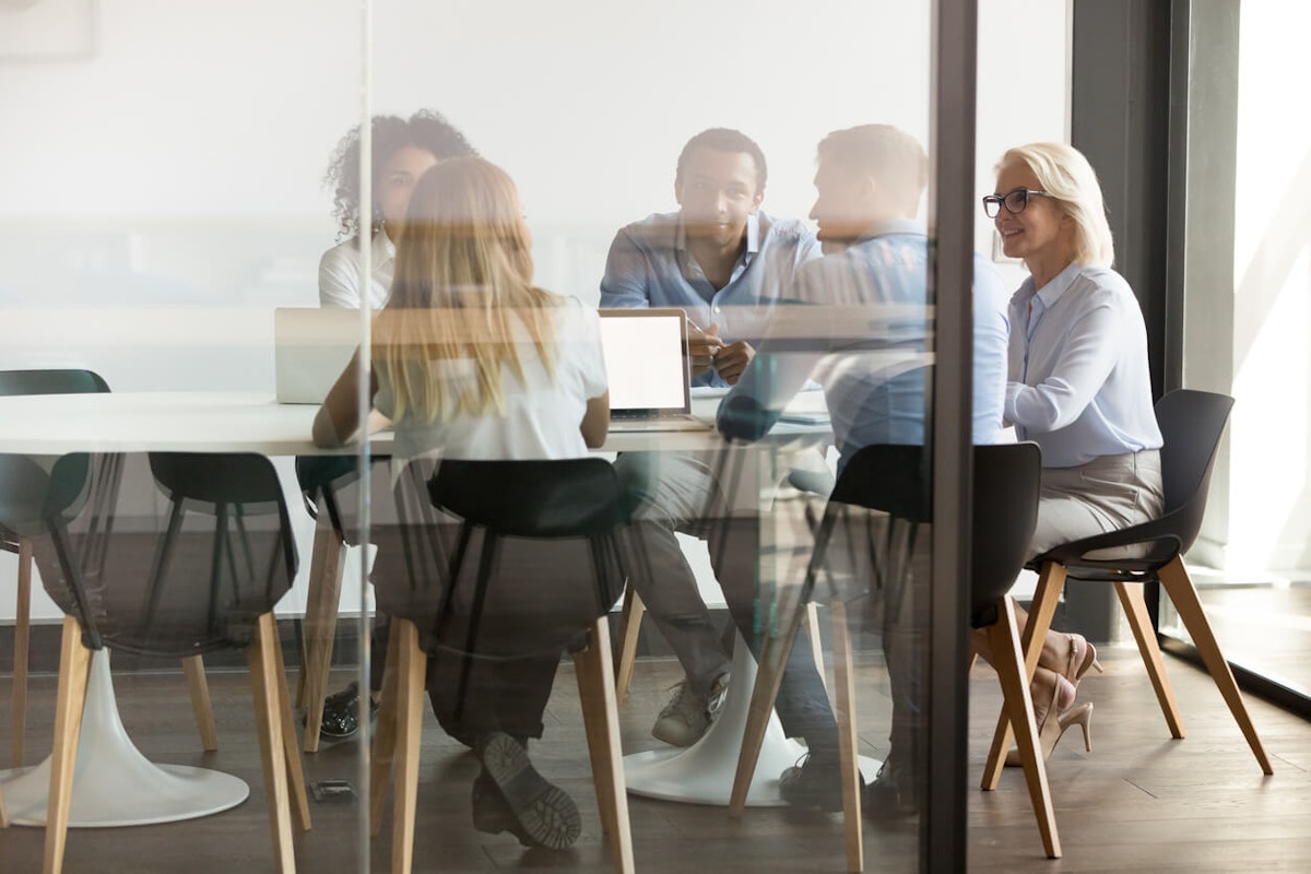 employees talking in a room