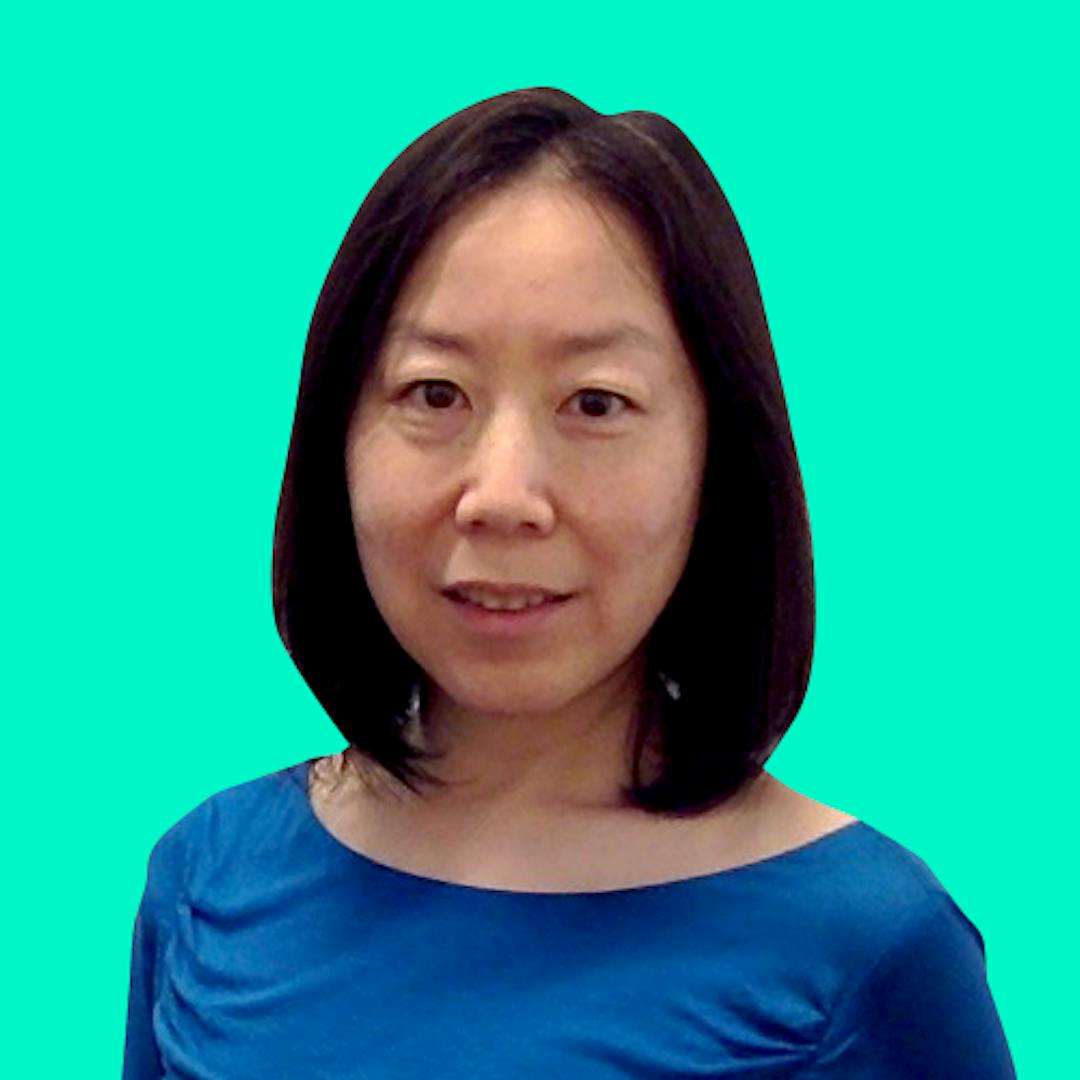 A smiling photo of Jing Zhu on a solid turquois background