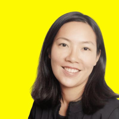 A smiling photo of Angela Kwan on a solid yellow background